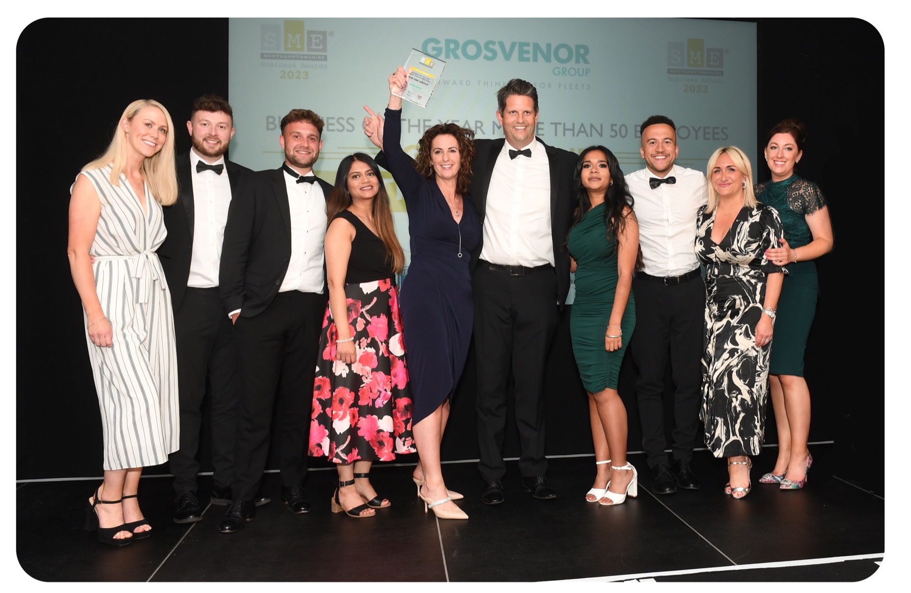 The ONE Group team celebrating their business awards